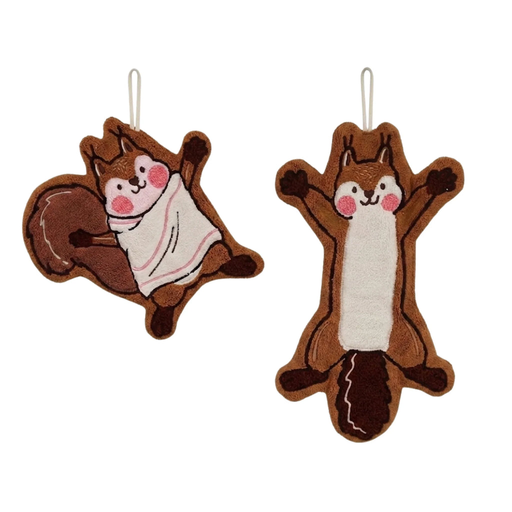 Cute brown cartoon squirrel hanging hand towels displayed on a white wall rack with metal hooks, showcasing practical home decor and a heartwarming style in a kitchen or bathroom setting.