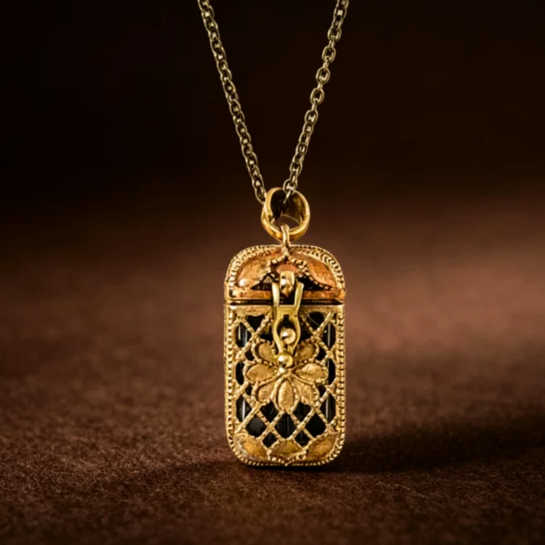 Gold pendant necklace with intricate design on a brown background
